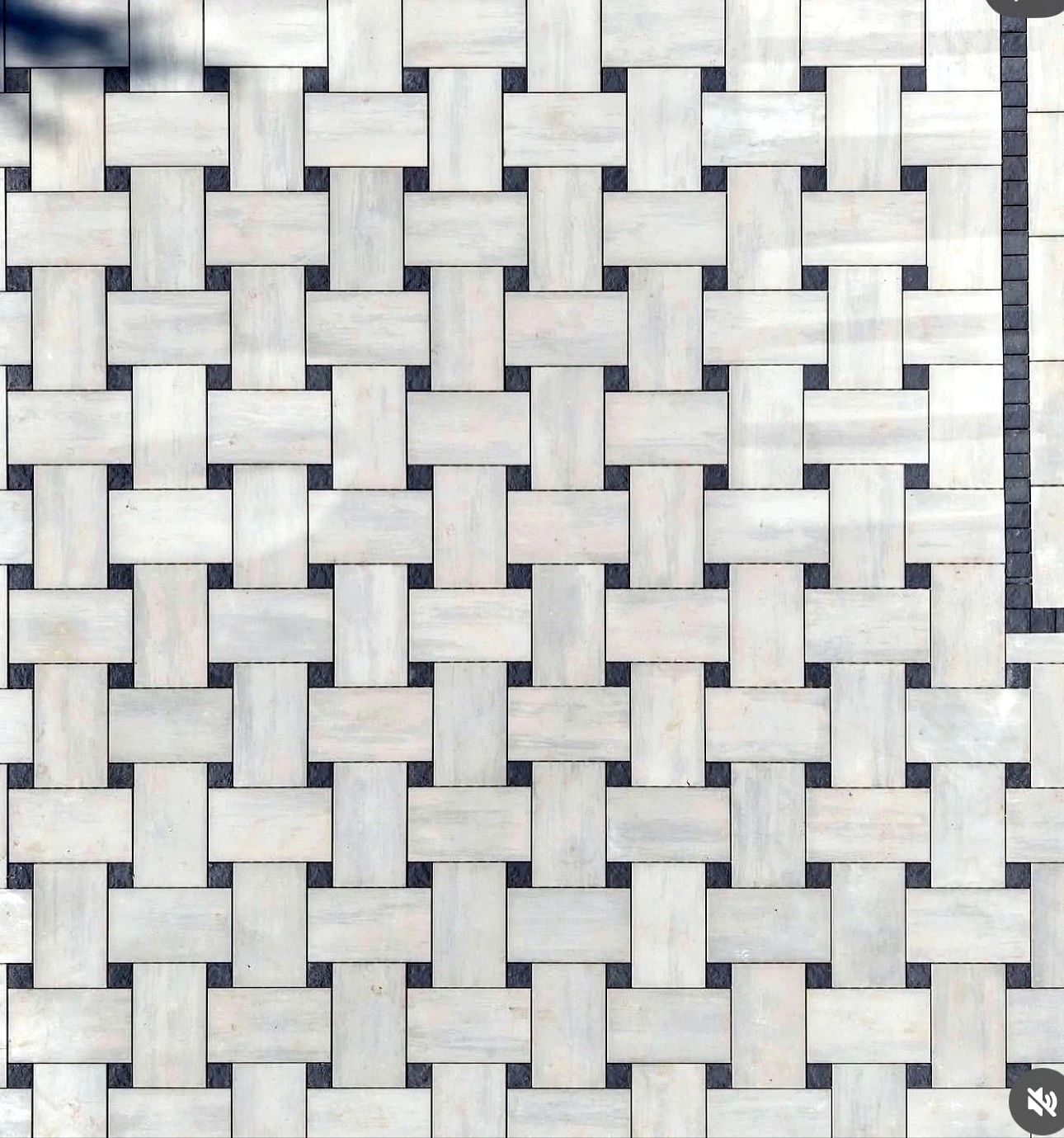 Top-down close-up of basketweave interlock pavers with charcoal accents — completed Pisces project in Toronto