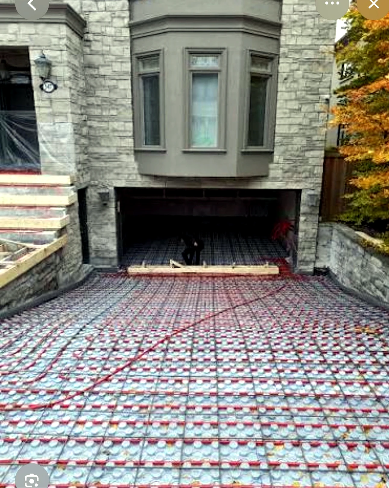 Real Pisces work — hydronic snow-melting pipe grid installed for a front walkway