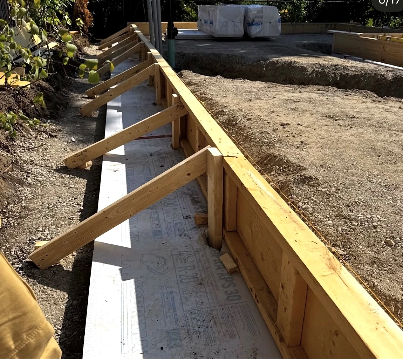 Real Pisces jobsite: wooden foundation formwork with diagonal bracing